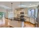 Bright kitchen with an island, stainless steel appliances, and granite countertops, perfect for cooking at 19753 E 54Th Ave, Denver, CO 80249