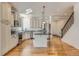 Spacious kitchen with stainless steel appliances, granite countertops, and a center island at 19753 E 54Th Ave, Denver, CO 80249