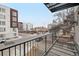 Apartment balcony offers an open street view and black metal railings at 2162 S Ash St, Denver, CO 80222