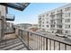 Apartment balcony has a view of surrounding apartment buildings and a metal grate floor at 2162 S Ash St, Denver, CO 80222