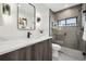 Modern bathroom features a glass shower, a sleek vanity, and contemporary fixtures at 2162 S Ash St, Denver, CO 80222