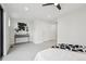 Bright bedroom features neutral decor, a console table, and an overhead fan at 2162 S Ash St, Denver, CO 80222