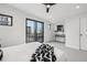 Bright bedroom with soft carpet, neutral tones, a balcony, and ample natural light at 2162 S Ash St, Denver, CO 80222