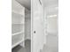 Walk-in closet boasts ample shelving, a clothing rod, and sliding doors at 2162 S Ash St, Denver, CO 80222