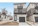 Modern home featuring multiple balconies and a two-car garage, with contemporary design at 2162 S Ash St, Denver, CO 80222