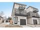 Exterior of modern home featuring multiple balconies and a two-car garage at 2162 S Ash St, Denver, CO 80222