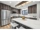 Contemporary kitchen featuring stainless steel appliances, quartz counters, and a center island at 2162 S Ash St, Denver, CO 80222