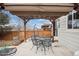 Backyard patio with awning coverage for shade and cozy atmosphere for outdoor relaxation and entertainment at 16278 E 105Th Way, Commerce City, CO 80022