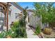 Backyard area featuring a shed, privacy fence, and lush landscaping providing a serene outdoor escape at 16278 E 105Th Way, Commerce City, CO 80022
