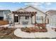 Backyard view featuring a patio, pergola, and shed, perfect for outdoor relaxation and storage at 16278 E 105Th Way, Commerce City, CO 80022