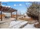 Backyard featuring a covered pergola, patio seating, and a storage shed for outdoor enjoyment and convenience at 16278 E 105Th Way, Commerce City, CO 80022