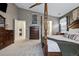 Bedroom with a four poster bed, two dressers, macrame wall hangings, and a ceiling fan at 16278 E 105Th Way, Commerce City, CO 80022