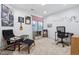 Versatile bedroom with decorative guitars, music-themed decor, a cozy armchair and a functional workstation at 16278 E 105Th Way, Commerce City, CO 80022