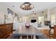 Elegant dining room with modern lighting, hardwood floors, and an open layout at 16278 E 105Th Way, Commerce City, CO 80022