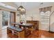 Cozy dining room featuring hardwood floors, modern lighting, and sliding doors to the patio at 16278 E 105Th Way, Commerce City, CO 80022