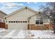 A one story single Gathering home, featuring a two car garage and stone accents at 16278 E 105Th Way, Commerce City, CO 80022