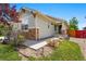 Charming single-story home featuring stone accents, complemented by a landscaped front yard and inviting entrance at 16278 E 105Th Way, Commerce City, CO 80022