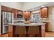 This beautiful kitchen features dark wood cabinets, granite countertops, and stainless steel appliances at 16278 E 105Th Way, Commerce City, CO 80022