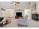 Comfortable living room featuring a corner fireplace, plush carpeting and a vaulted ceiling at 16278 E 105Th Way, Commerce City, CO 80022