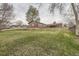 Expansive backyard with lush green lawn, offering ample space for recreation at 3150 W Stanford Ave, Englewood, CO 80110