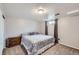 Cozy bedroom with window, side table, and plush carpeting at 3150 W Stanford Ave, Englewood, CO 80110