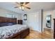 Comfortable bedroom featuring hardwood floors, ceiling fan, and ample closet space at 3150 W Stanford Ave, Englewood, CO 80110