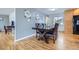 Dining room with hardwood floors, gray walls, and a decorative gallery wall at 3150 W Stanford Ave, Englewood, CO 80110
