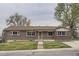 Charming brick home featuring well-maintained landscaping and a welcoming entryway at 3150 W Stanford Ave, Englewood, CO 80110