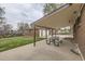 Spacious covered patio with a picnic table, perfect for outdoor gatherings at 3150 W Stanford Ave, Englewood, CO 80110