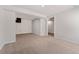Finished basement featuring neutral carpeting and white trim at 1774 Brookside Dr, Highlands Ranch, CO 80126