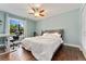 Bright bedroom with hardwood floors, ceiling fan and plush bed perfect for relaxation at 1774 Brookside Dr, Highlands Ranch, CO 80126