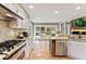 Stylish kitchen features stainless steel appliances, granite counters, and a cozy breakfast nook at 1774 Brookside Dr, Highlands Ranch, CO 80126