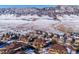 Aerial view of community nestled in snowy mountainside at 9876 W Freiburg Dr # G, Littleton, CO 80127