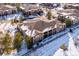 Aerial view of townhomes in snowy landscape at 9876 W Freiburg Dr # G, Littleton, CO 80127