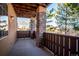 Private balcony with mountain views and stone columns at 9876 W Freiburg Dr # G, Littleton, CO 80127