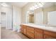 Bathroom with double sinks, shower, and separate tub at 9876 W Freiburg Dr # G, Littleton, CO 80127