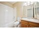 Main bathroom with tub, toilet, and vanity at 9876 W Freiburg Dr # G, Littleton, CO 80127