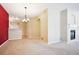 Dining area with chandelier and view of kitchen and living room at 9876 W Freiburg Dr # G, Littleton, CO 80127