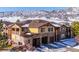 Exterior of a townhome with mountain backdrop at 9876 W Freiburg Dr # G, Littleton, CO 80127