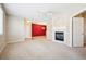 Living room with fireplace, carpet, and adjacent dining area at 9876 W Freiburg Dr # G, Littleton, CO 80127