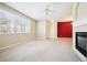 Living room with fireplace and view of entryway and dining area at 9876 W Freiburg Dr # G, Littleton, CO 80127