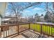 A lovely back deck overlooks the bright green yard and snow-covered areas, providing a nice outdoor living space at 11886 W 107Th Ave, Westminster, CO 80021