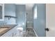 A beautifully designed bathroom with granite vanity top, wood-look floors, and a glass shower at 11886 W 107Th Ave, Westminster, CO 80021