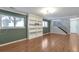 Spacious living room featuring wood floors, built-in shelves, and plenty of natural light at 11886 W 107Th Ave, Westminster, CO 80021