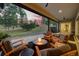 Relaxing outdoor living space with seating, fire pit, and scenic views of the forest at 9228 Lone Timber Ct, Parker, CO 80134
