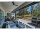 Spacious covered patio featuring a grill, outdoor dining, comfortable seating, and scenic backyard views at 9228 Lone Timber Ct, Parker, CO 80134