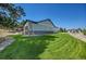 A spacious backyard featuring green lawn and a patio, perfect for outdoor enjoyment and relaxation at 9228 Lone Timber Ct, Parker, CO 80134