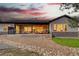 Beautiful backyard patio with cozy seating and outdoor fireplace, great for entertaining at 9228 Lone Timber Ct, Parker, CO 80134