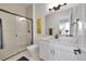 Modern bathroom featuring a sleek vanity, quartz countertop, and a glass-enclosed shower at 9228 Lone Timber Ct, Parker, CO 80134