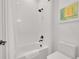 Clean bathroom featuring a bathtub, shower with white tiling, and modern fixtures at 9228 Lone Timber Ct, Parker, CO 80134